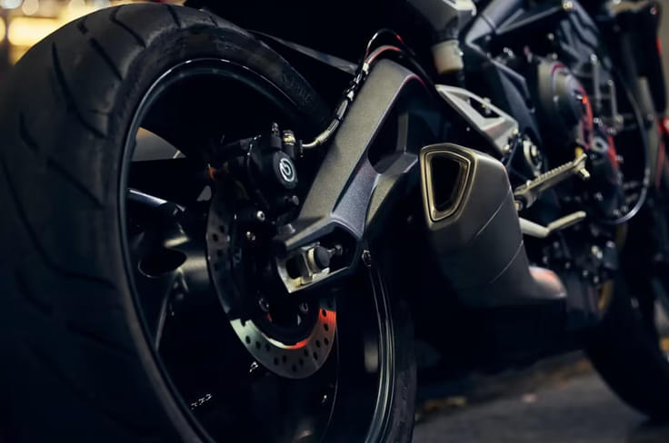 Features twin discs with Brembo M4.32 calipers Triumph Street Triple R in orange rear tyre shot
